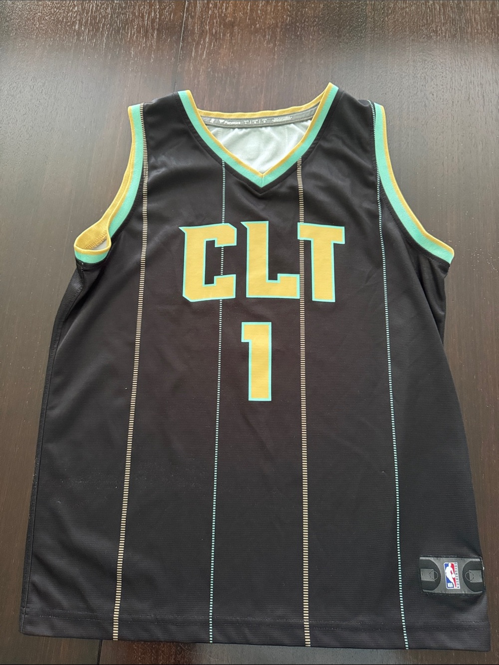 Fanatics Black Basketball Jersey with Yellow and Teal Trim